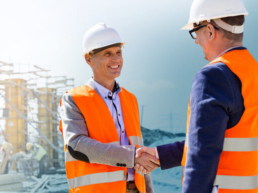 hero--blog-trusted_partnerships-lower Two workers in hi-vis shaking hands on a construction site