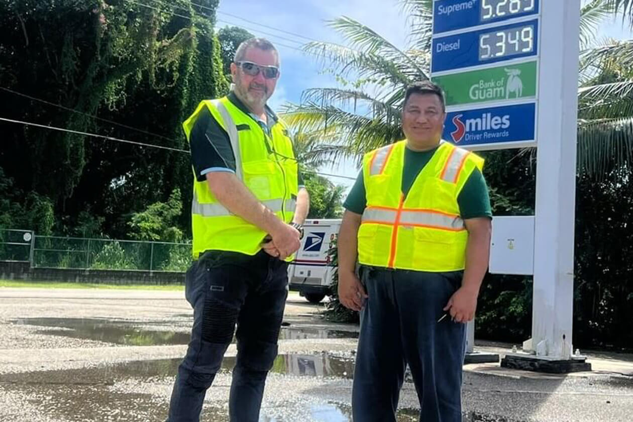Dan and Jon standing outside a Mobil service station