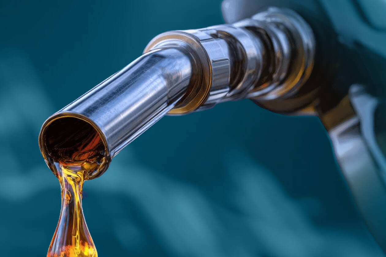 Fuel pouring from a dispenser nozzle