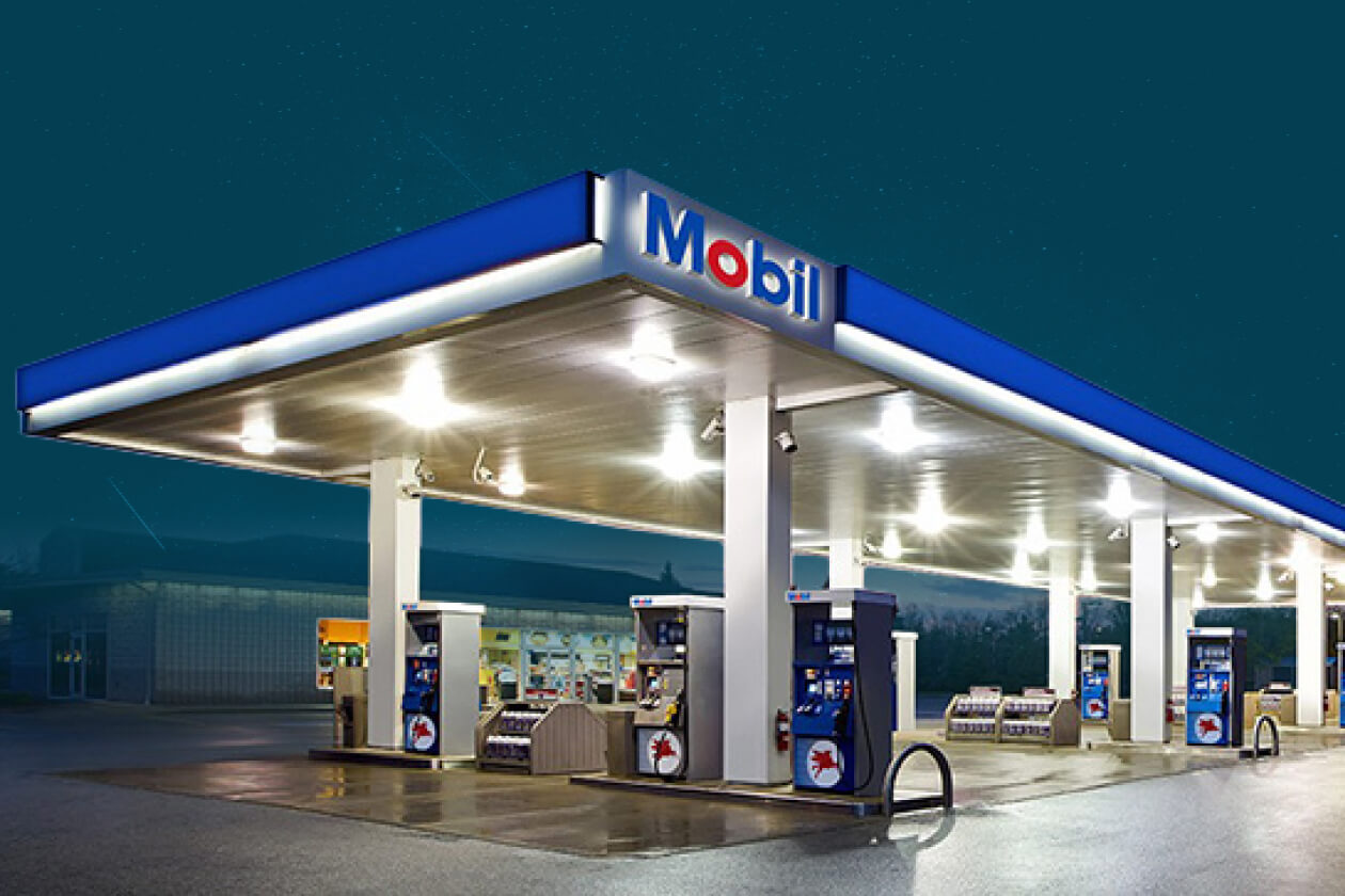Mobil service station forecourt at dusk