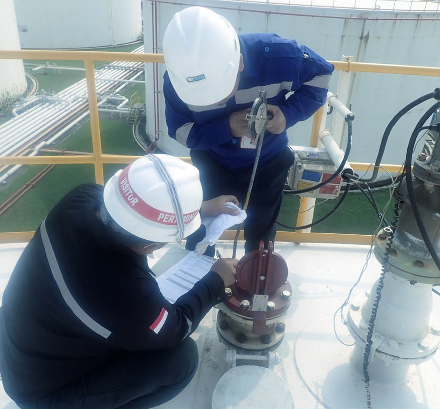 Technicians carrying out a fuel system compliance audit